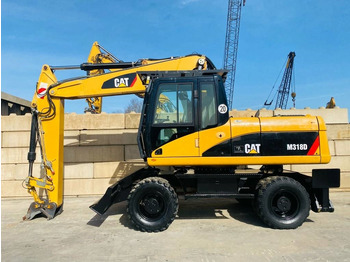 Pelle sur pneus CATERPILLAR M318D